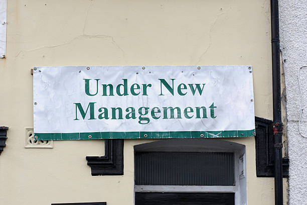 istock Under new management sign above doorway 183420441
