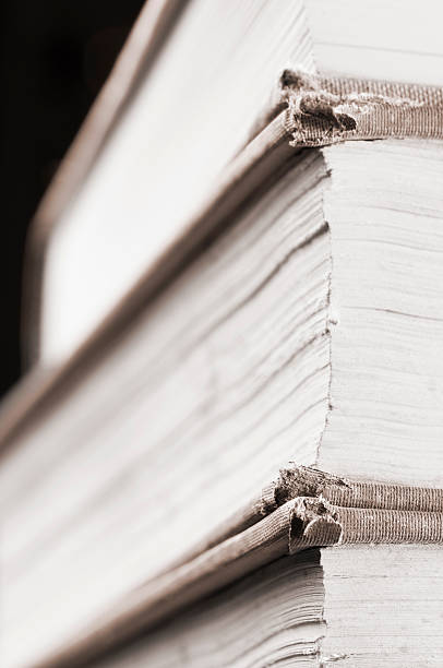 istock Pile of dusty books with torn leather covers 183420452