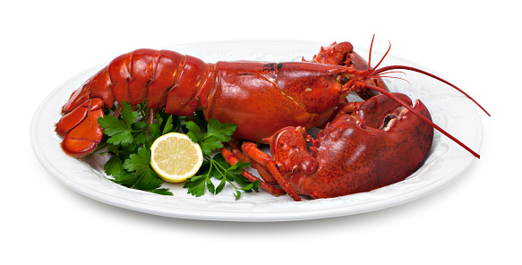 Lobster platter with lemon and parsley garnish.