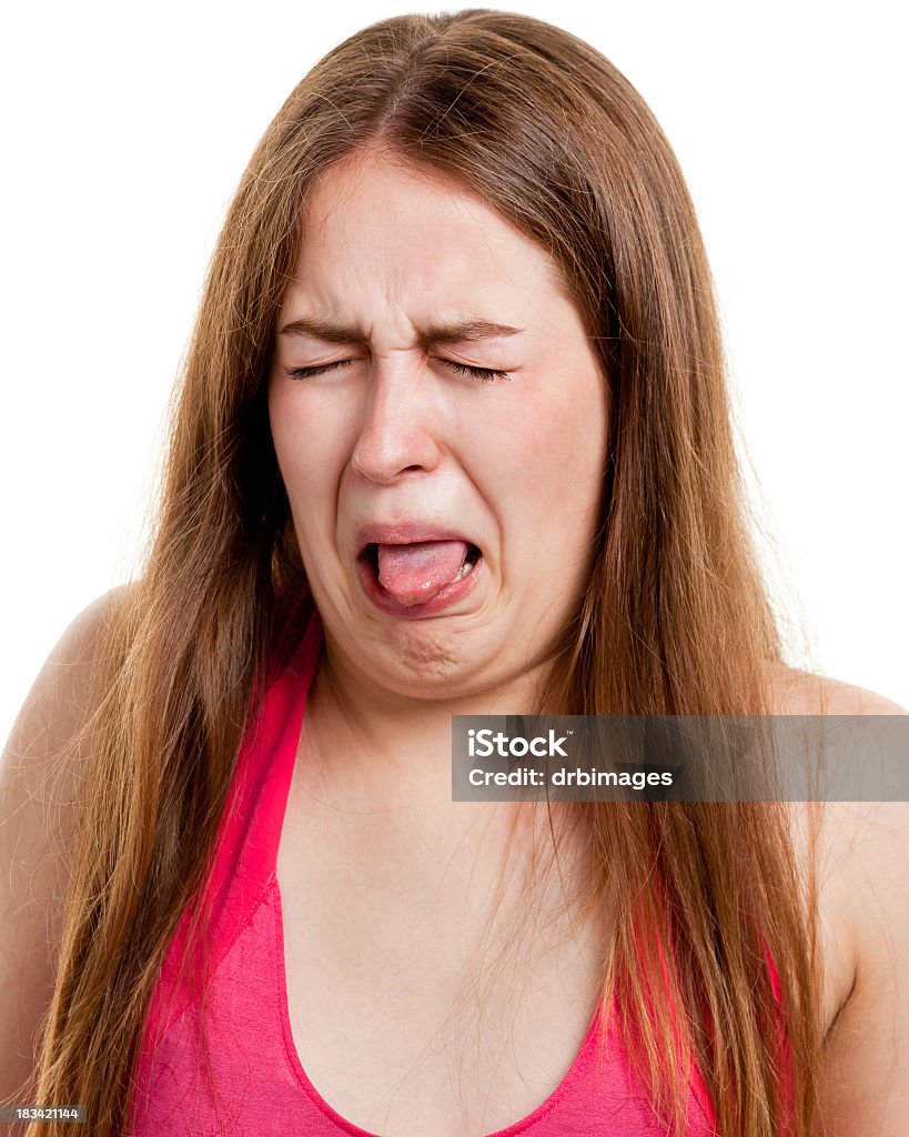Disgusted Young Woman Sticking Out Tongue Portrait of a young woman on a white background.http://s3.amazonaws.com/drbimages/m/anarul.jpg Disgust Stock Photo