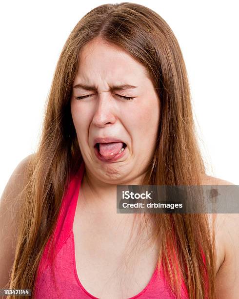 Disgusted Young Woman Sticking Out Tongue Stock Photo - Download Image Now - Disgust, Sour Taste, Women