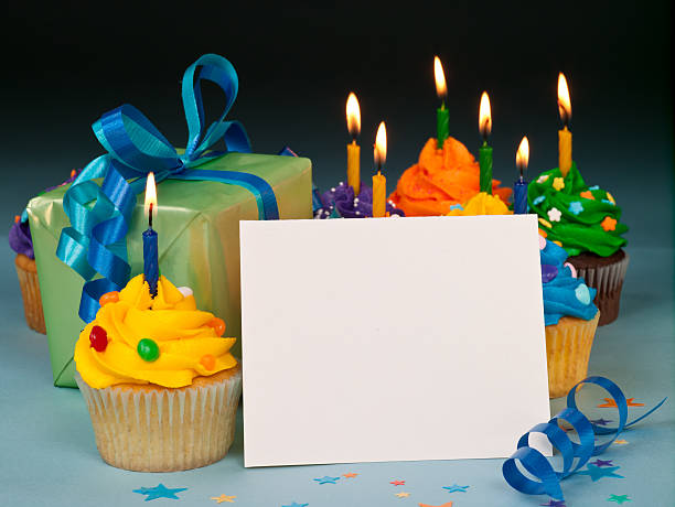 Celebration cupcakes with blank card stock photo