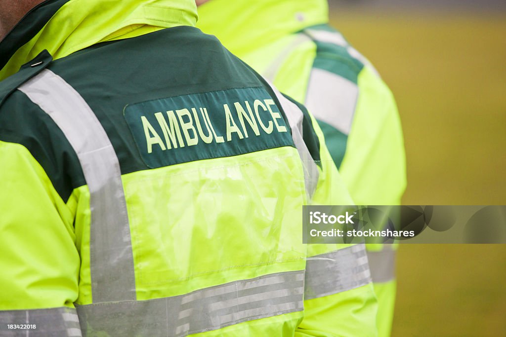 Ambulance Staff in Attendance "Two UK Ambulance paramedics in attendance at an outdoor event. Copy space," Ambulance Stock Photo