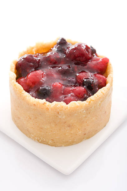 istock Red fruit and praline dessert isolated on white 183422041