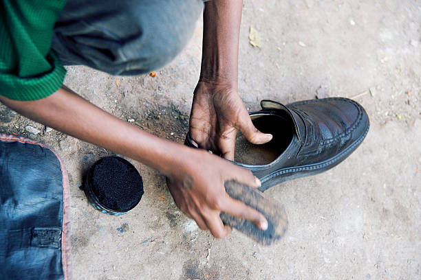 Child shoeshiner Hands of child shoeshiner at work shoe polish stock pictures, royalty-free photos & images