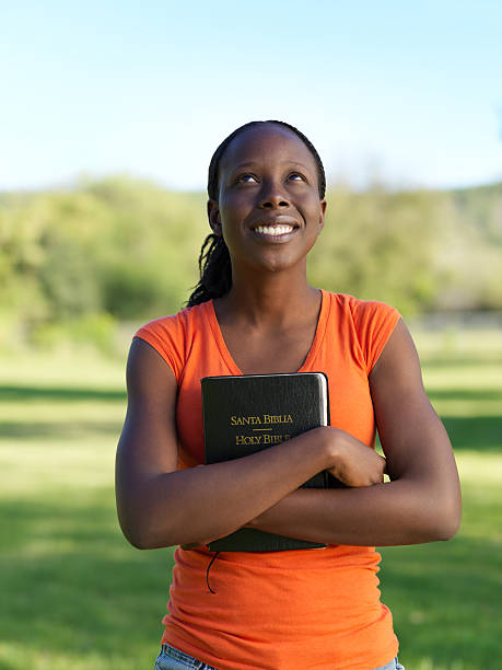Woman embracing a Bible