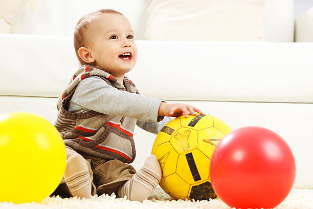 istock Little boy is playing with balls. 183422316