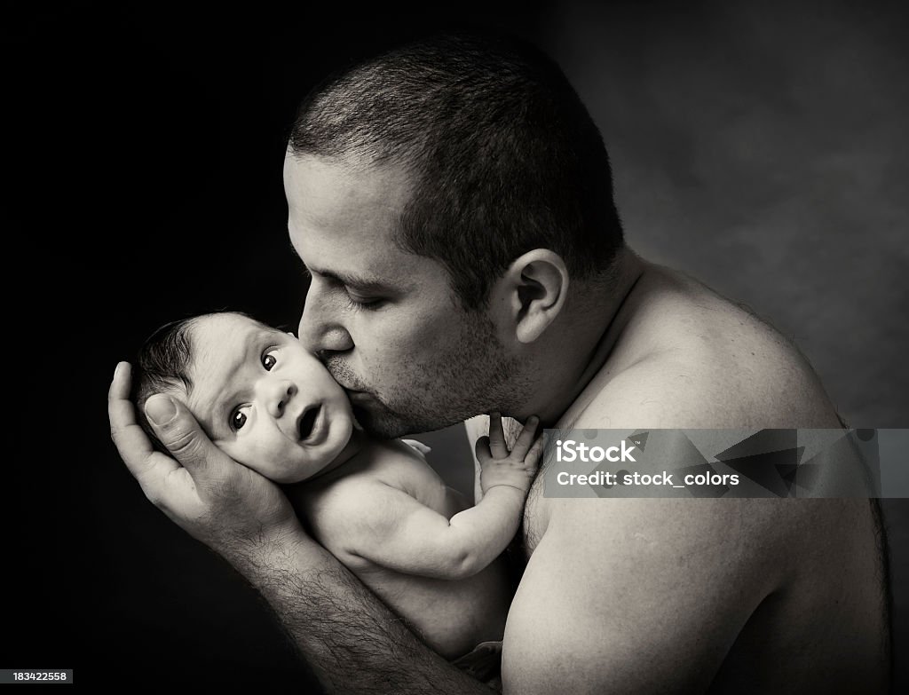 father kiss father kissing daughter; black and white. Baby - Human Age Stock Photo