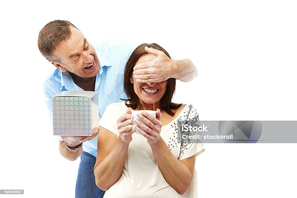 Mature couple isolated on white background with presents senior husband and wife together. Isolated on white and good for cutout. 50-59 Years Stock Photo