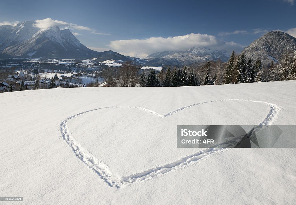 Snow Heart Love - Winter Panorama (XXL) Huge Snow Heart drawn in the fresh snow in front of a beautiful winter panorama (XXL) Great detailed texture. Converted from RAW. Nikon D3X. Heart Shape Stock Photo