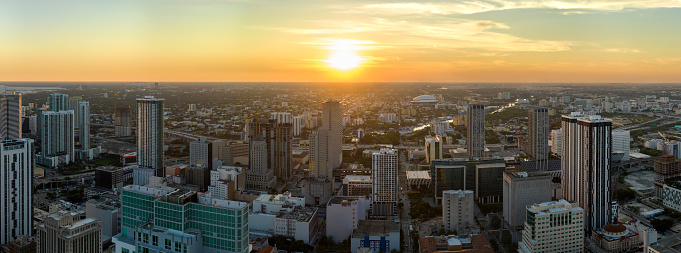 Aerial view of downtown office district of Miami Brickell in Florida, USA at sunset. High commercial and residential skyscraper buildings in modern american megapolis.