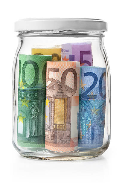 geld. euro-banknoten in einem glas jar. - currency jar coin donation box stock-fotos und bilder
