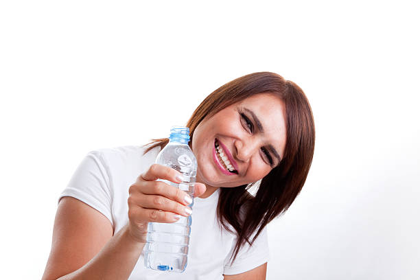 istock middle age woman drinking water 183423394