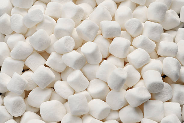 MIni Marshmallow Background Close up of mini marshmallows.  See also marshmallow photos stock pictures, royalty-free photos & images