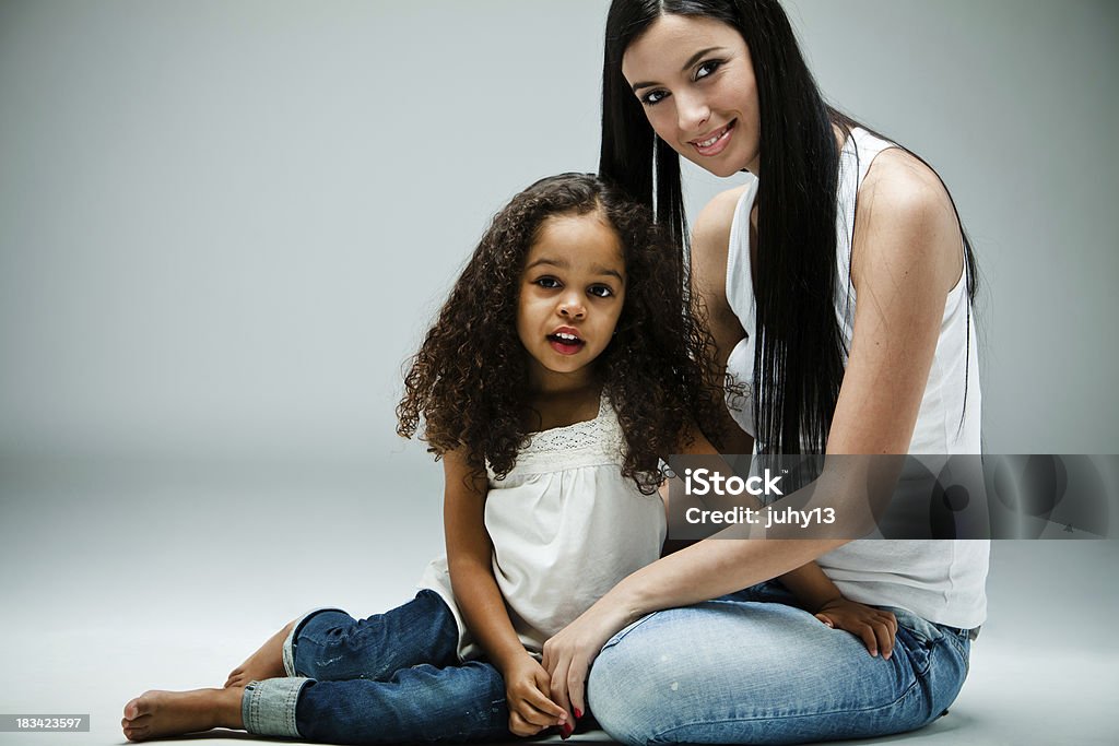 Mixed race girls Young caucasian girls with a mixed race little girl - studio shootSImilar images: 6-7 Years Stock Photo