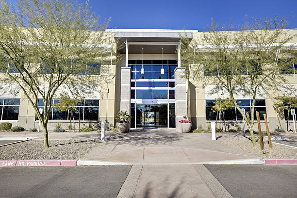 istock Two story office building against blue sky 183424250