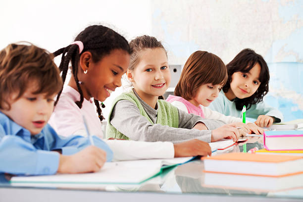 istock Children are sitting in the classroom and writing. 183424457