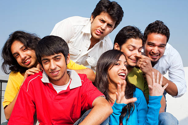 istock Six Cheerful Excited Indian Friends Having a Fun Time 183424499