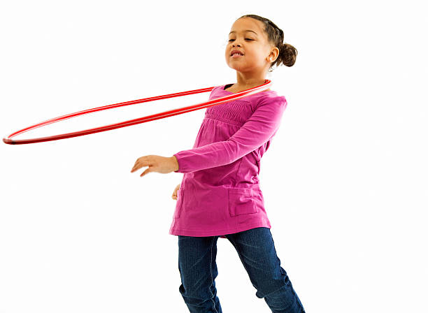 istock Young Girl Playing with Hulahoop 183424544