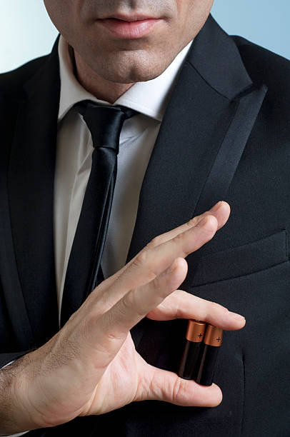 istock Businessman holding batteries in his hand 183424922