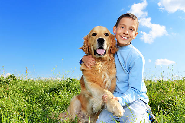 istock Dog is giving a paw to boy 183425380