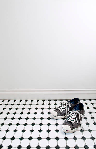 istock Sneakers On Bathroom Floor 183425560