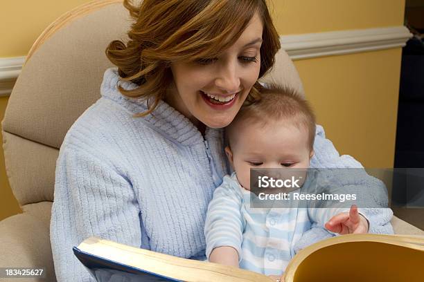Mother Reading To Child At Bedtime Stock Photo - Download Image Now - Baby - Human Age, Rocking Chair, Women