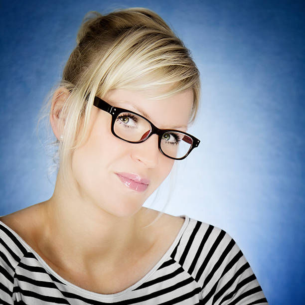 Blonde beautiful woman with wayfarer glasses Portrait of a blonde beautiful woman wearing wayfarer glasses hochsteckfrisur stock pictures, royalty-free photos & images