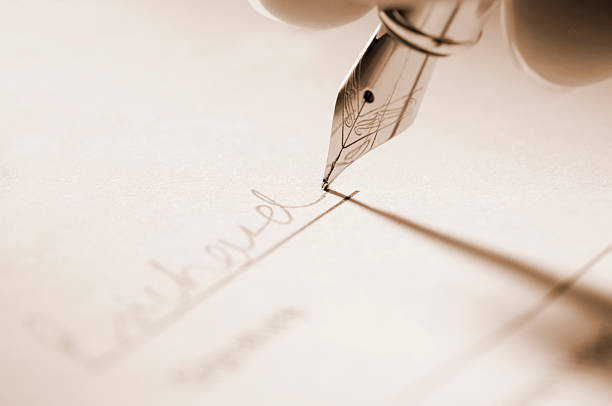 istock Fountain pen signing signature on paperwork 183426172