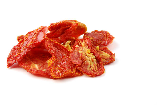 Organic sun dried tomatoes on white background.