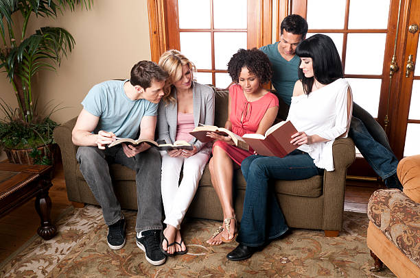 istock Small Group of young adults at  informal Bible study 183426359