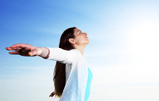 istock Young woman is enjoying against the blue sky. 183426827