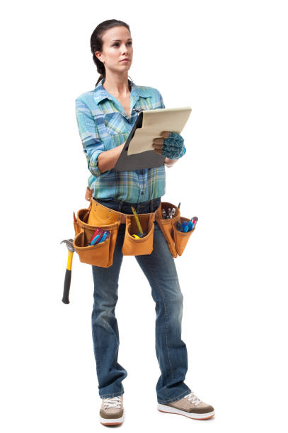 Woman Construction Contractor Carpenter Isolated on White Background Woman Construction Contractor Carpenter Isolated on White Background woman wearing tool belt stock pictures, royalty-free photos & images