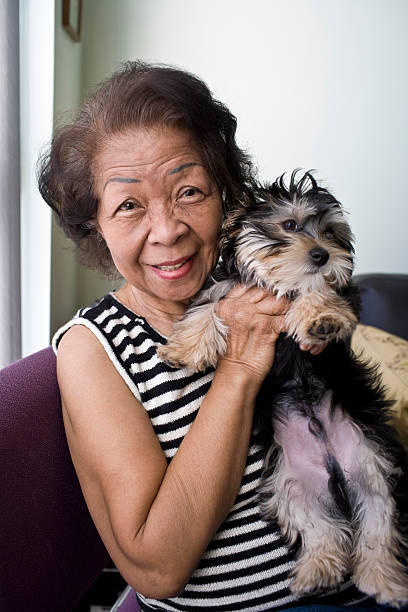 istock Senior with a Puppy 183427074