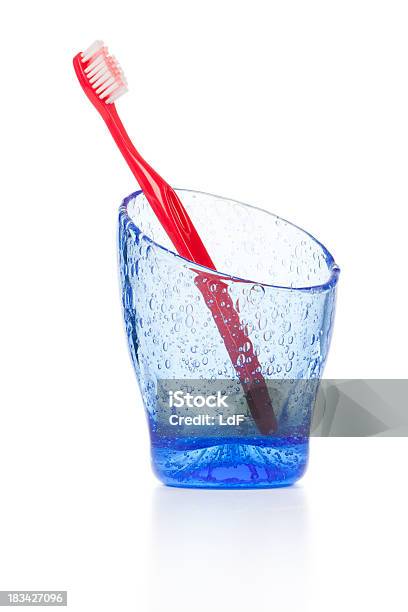 One Toothbrush In A Blue Glass Isolated On White Stock Photo - Download Image Now - Beauty, Blue, Bright