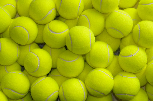 Loose Tennis Balls Pile of loose tennis balls tennis ball stock pictures, royalty-free photos & images