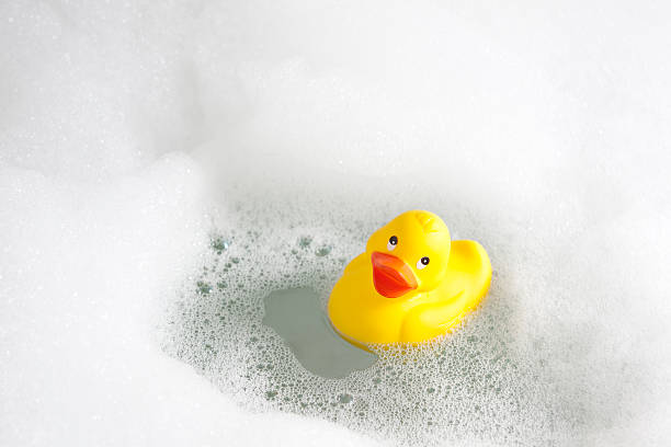Bubble bath with a rubber duck  stock photo