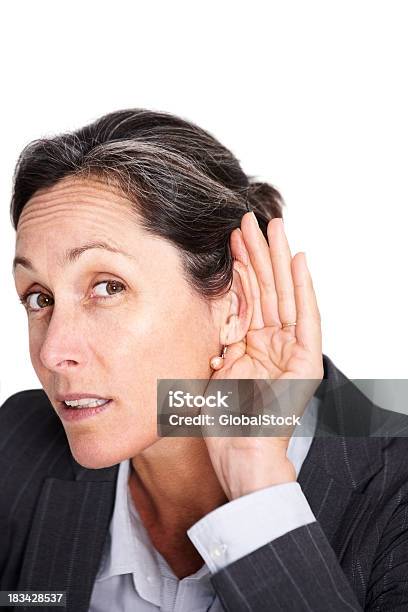 Beautiful Businesswoman Trying To Listen Something Stock Photo - Download Image Now - 40-49 Years, Adult, Adults Only