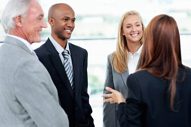 istock People in discussion with their leader 183428995