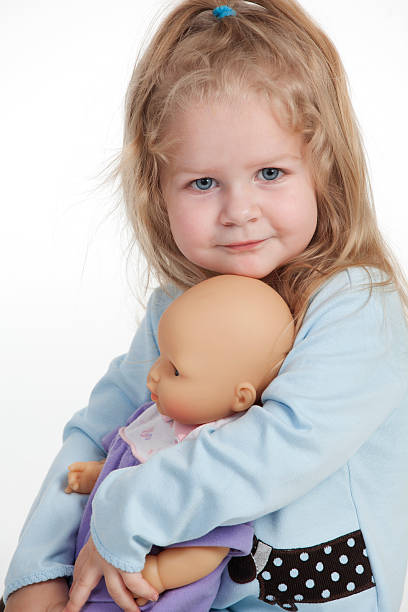 istock Beautiful toddler with doll 183429051