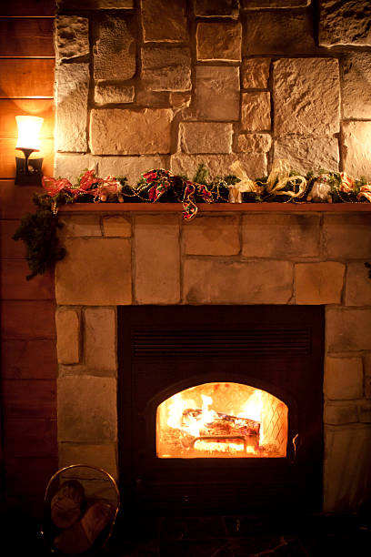 istock Fireplace in wood chalet 183429345