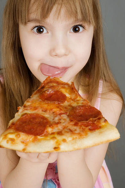 istock Yummy pizza with young girl happy 183429561