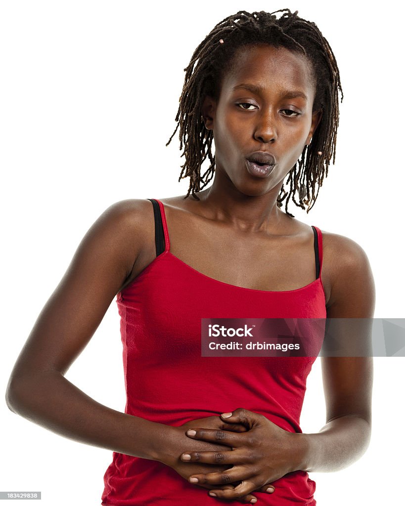 Young Woman With Hands On Stomach Portrait of a young woman on a white background. Abdomen Stock Photo