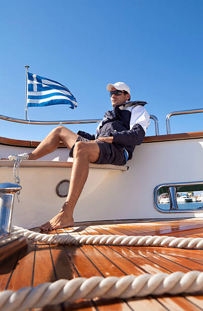 istock Sailor relaxing on the yacht's deck 183429955