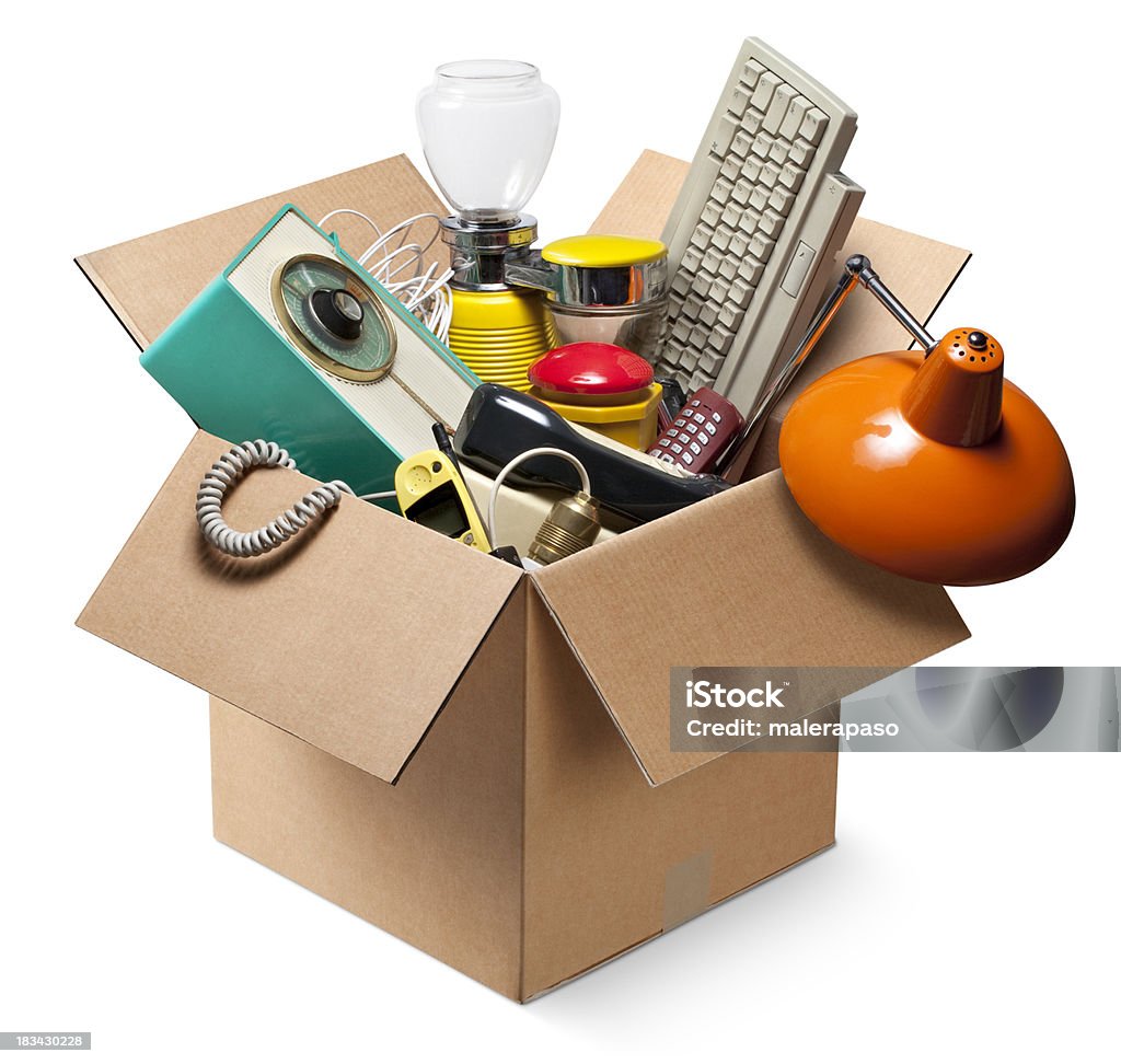 Cardboard box with old electrical appliances Moving house. Cardboard box with old electrical appliances.  Garage Sale Stock Photo