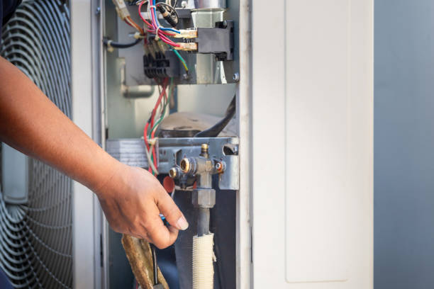 istock Technician man fixing modern air conditioner, repairing and servicing, Maintenance and repairing concepts 1834303765