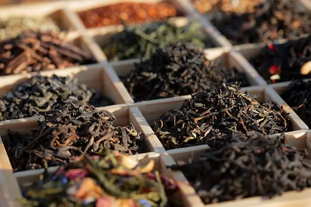 "Varieties of tea in a wood box. Similar photos on my portfolio. Focus in centre (Darjeeling, Lapsang Souchong)"