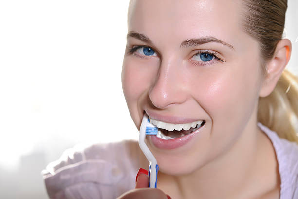 istock woman with tooth brush 183431012