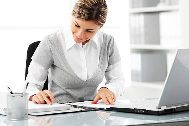 istock Business woman is reading a note in the office. 183431112