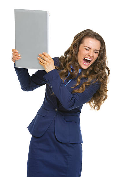 istock Angry business woman breaking laptop 183431130